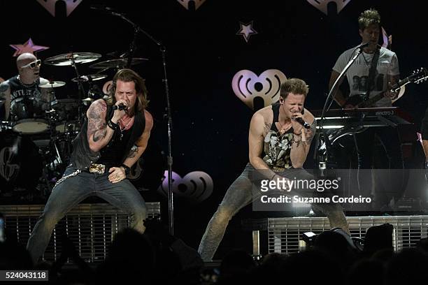 Tyler Hubbard and Brian Kelly of Florida Georgia Line perform onstage during the iHeartRadio Country Festival at the Frank Erwin Center on March 29,...