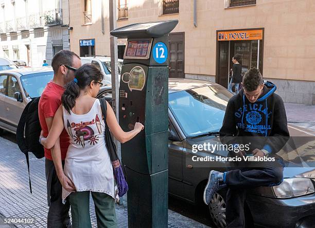 Parking meter in Barrio de las Letras, Madrid, Spain, 13 September 2013. Barrio de las Letras, is a neighborhood west of Paseo del Prado, famous for...