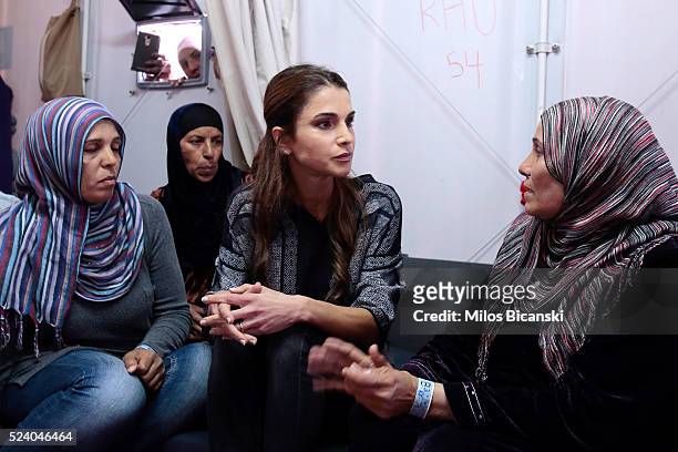 APRIl 25: Queen Rania of Jordan meets Syrian refuges at the Karatepe municipality camp for refugees on the outskirts of Mytilene, on April 25, 2016...