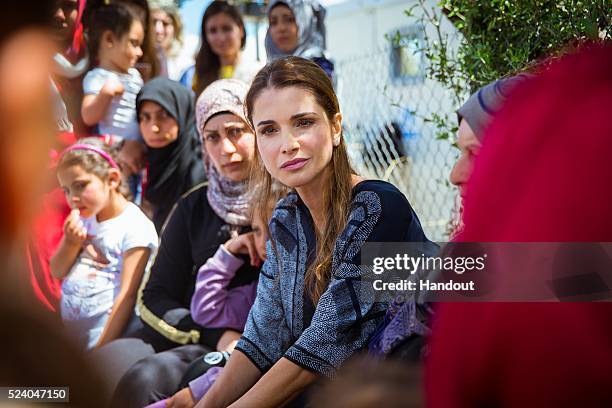 APRIl 25: In this handout image supplied by the Office of Her Majesty Queen Rania Al Abdullah, Royal Hashemite Court, Queen Rania of Jordan meets...