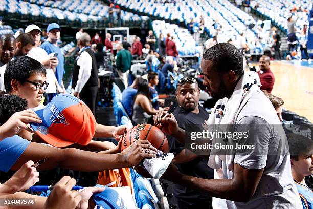 Serge Ibaka of the Oklahoma City Thunder signs autographs for fans prior to Game Four of the Western Conference Quarterfinals of the 2016 NBA...