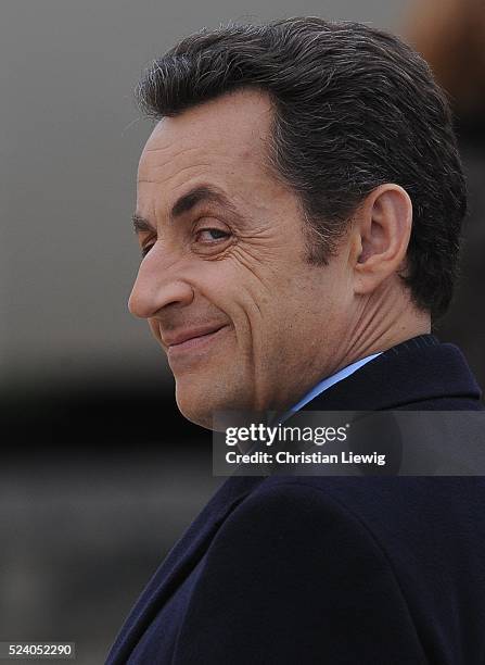 French President Nicolas Sarkozy smiles during the ceremony held in memory of French soldiers who served during World War I, at the Invalides, Paris,...