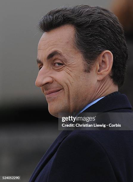 French President Nicolas Sarkozy smiles during the ceremony held in memory of French soldiers who served during World War I, at the Invalides, Paris,...