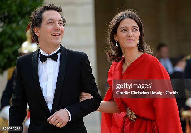 Guillaume Gallienne and Amandine Gallienne arrive at the Elysee Palace for a State dinner in honor of Queen Elizabeth II, hosted by French President...