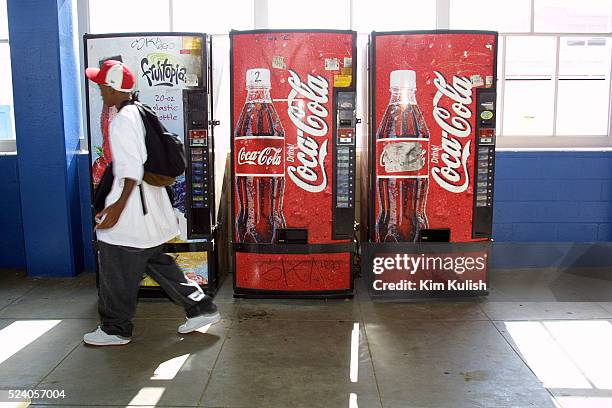 Student at Venice High School in Los Angeles walks past a row of soda vending machines located on campus. The Los Angeles Unified District board, the...