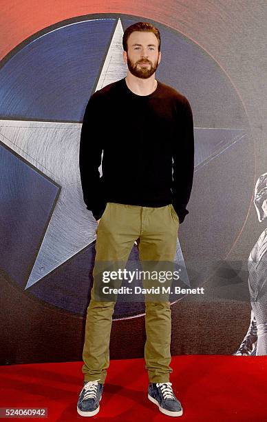 Chris Evans poses at a photocall for "Captain America: Civil War" at The Corinthia Hotel London on April 25, 2016 in London, England.