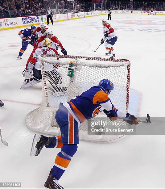 John Tavares of the New York Islanders scores the game winning goal at 10:41 of the second overtime against Roberto Luongo of the Flrorida Panthers...