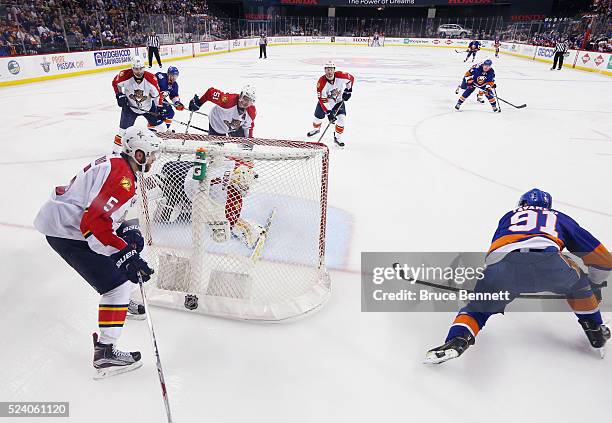 John Tavares of the New York Islanders scores the game winning goal at 10:41 of the second overtime against Roberto Luongo of the Flrorida Panthers...