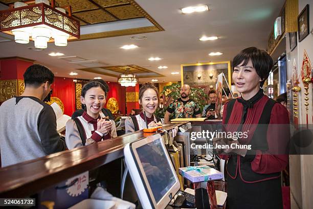 Ji Soo-won, far right, and other actors rehearse on the set of a South Korean TV drama 'Gahwamansasung' or Bong's Happy Restaurant by MBC on April...