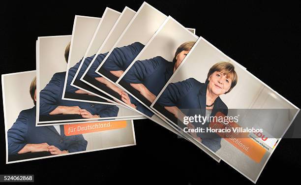 German Chancellor Angela Merkel postcards are on display at Germania Rowing Club, in Frankfurt, Germany, 01 September 2013, where CDU party members...