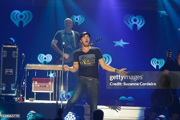 Luke Bryan performs onstage during iHeartRadio Country Festival in Austin at the Frank Erwin Center on March 29, 2014 in Austin, Texas.