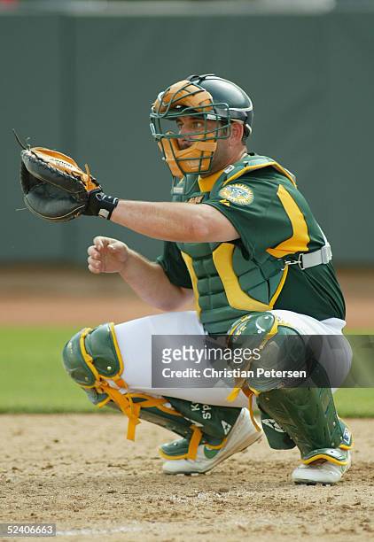 Jeremy Brown of the Oakland Athletics catches during the MLB spring training game against the Chicago Cubs at Phoenix Municipal Stadium on March 3,...