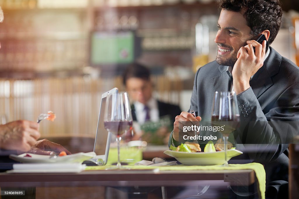 Businesspeople having lunch at the restaurant