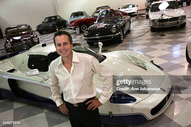 Douglas Magnon, President of Riverside Automotive Museum, who owns 30 Maseratis, in front of a a Maserati MC12 and other Maseratis on display at the...