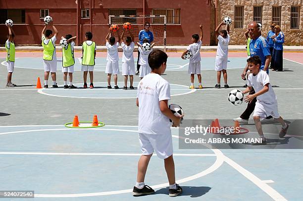 Palestinian physical education teachers take part in a training session organised by the Real Madrid Foundation at a school in the Qalandia refugee...