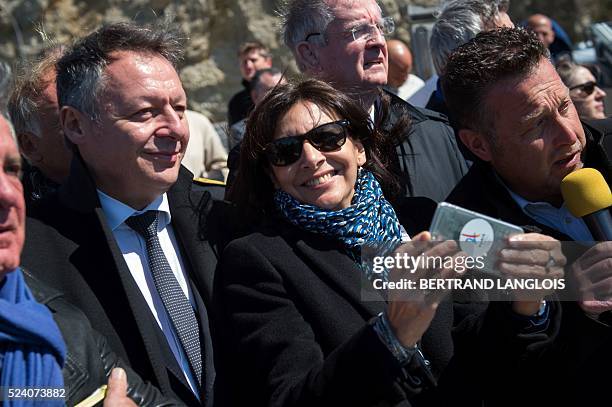 Mayor of Paris Anne Hidalgo poses for a selfie with French Junior Sports Minister Thierry Braillard during a visit to Marseille with members of the...