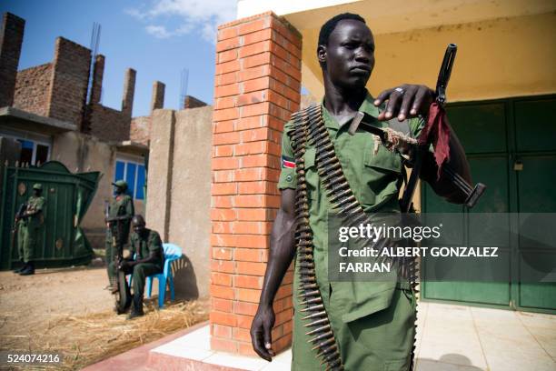 Member of the Sudan People's Liberation Army in Opposition stand guard at the military site in Juba, after the arrival of new troops and their chief...