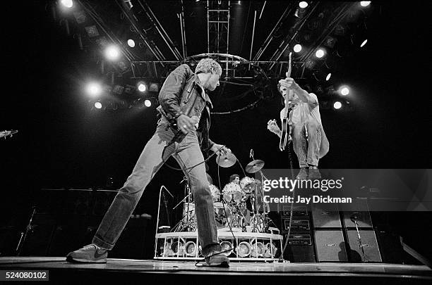Singer Roger Daltrey and guitarist Pete Townshend of the rock band The Who perform in concert.