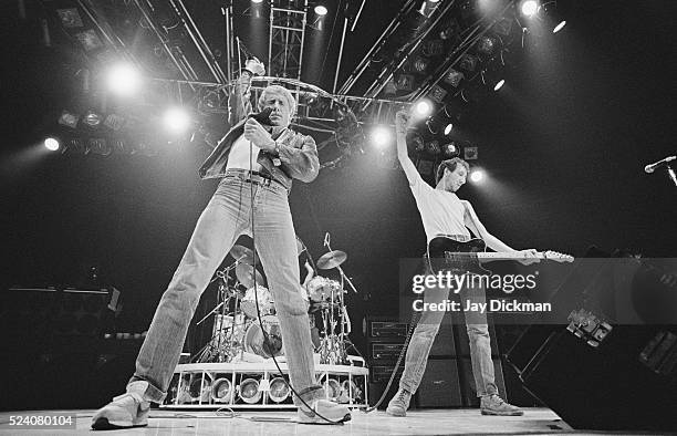 Singer Roger Daltrey and guitarist Pete Townshend of the rock band The Who perform in concert.