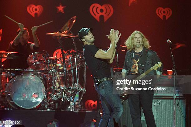 Luke Bryan performs onstage during iHeartRadio Country Festival in Austin at the Frank Erwin Center on March 29, 2014 in Austin, Texas.