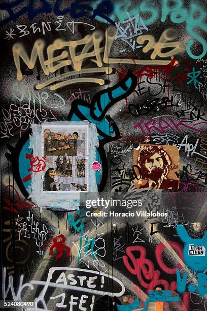 Graffiti covered door in El Raval, Ciutat Vella district of Barcelona, Catalonia, Spain, 25 January 2014. The neighborhood, also known as...