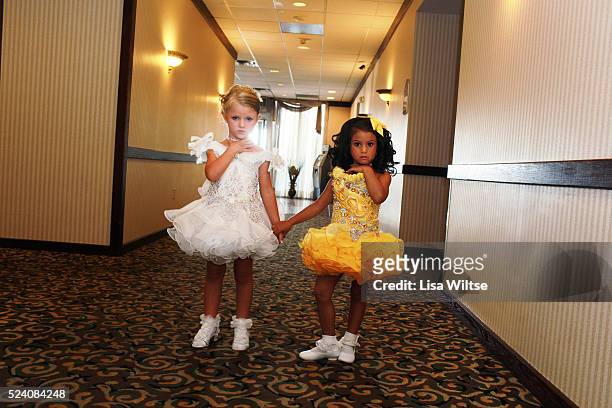 Joslyn and Jazlene, posing for a portrait before performing their beauty walk at the Crowne Plaza hotel during the Miss Cutie pageant in Syracuse,...