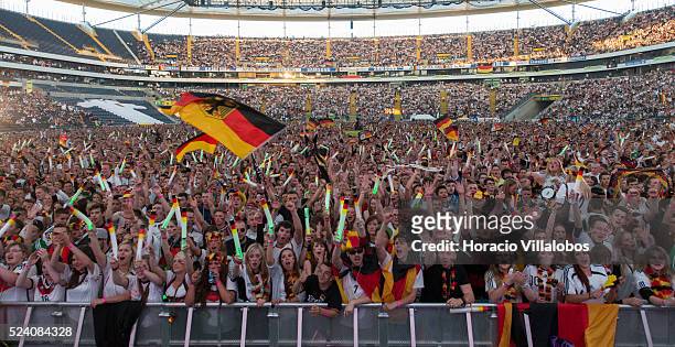 German fans cheer their team at the Commerzbank Arena in Frankfurt, Germany, 21 June 2014, while watching on a giant screen the Germany-Ghana soccer...
