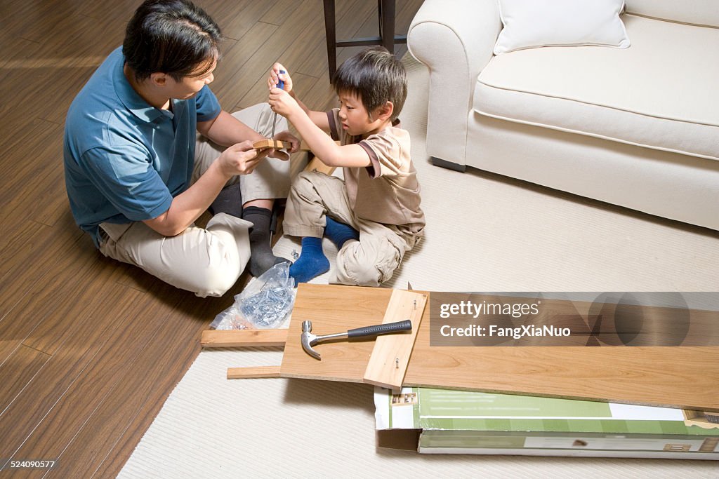 Father and Son Assembling Furniture