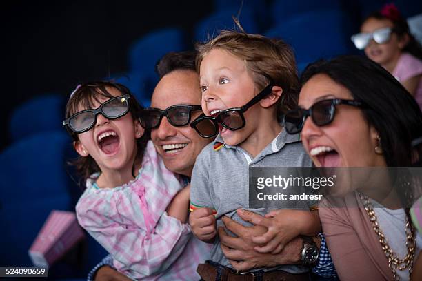 family at the movie theatre - 3d daughter stock pictures, royalty-free photos & images