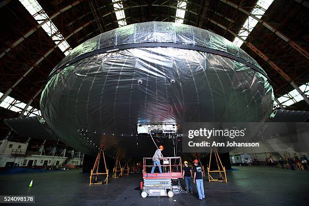 Electrical engineer James Schenkelberg, left, aeronautical engineer Louis Pu and mechanical engineer Armen Amirian work on the pneumatic sub-system...