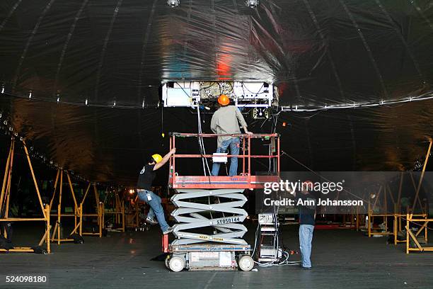 Aeronautical engineer Louis Pu, left, electrical engineer James Schenkelberg and mechanical engineer Armen Amirian work on the pneumatic sub-system...