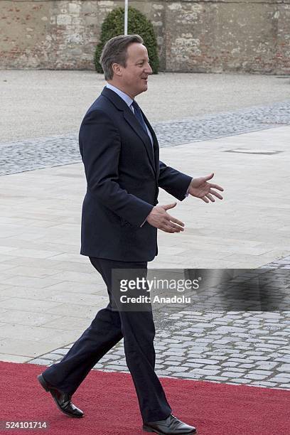 German Chancellor Angela Merkel welcomes British Prime Minister David Cameron before their meeting at Schloss Herrenhausen palace in Hanover, Germany...