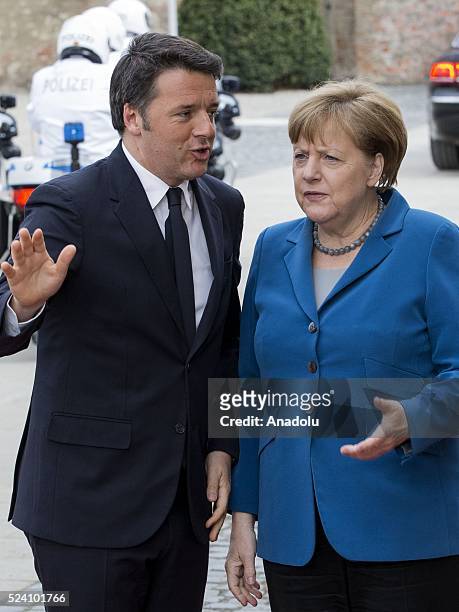German Chancellor Angela Merkel welcomes Italian Prime Minister Matteo Renzi before their meeting at Schloss Herrenhausen palace in Hanover, Germany...