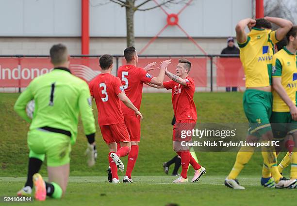 Lloyd Jones of Liverpool celebrates his goal with team mates Joe maguire and Ryan Kent during the Liverpool v Norwich City U21 Premier League game at...