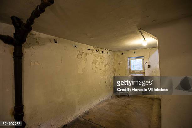 Hooks and a stool in the 'Strangling Room', called by the Nazis ‘Leichenkeller' , at the basement of the crematorium in Buchenwald concentration camp...