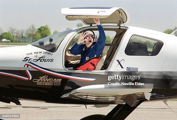 Pilot Erik Lindbergh waves from the cockpit of "the New Spirit of St. Louis" single engine aeroplane, before taking off. Erik, grandson of Charles...