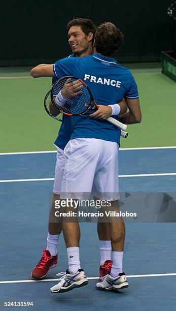 Julien Benneteau and Nicolas Mahut embrace at the end of the doubles played against Benjamin Becker and Andre Begemann of Germany, on the second day...