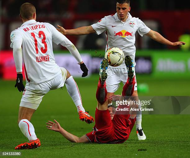 Alexander Ring of Kaiserslautern is challenged by Stefan Ilsanker and Diego Demme of Leipzig during the Second Bundesliga match between 1. FC...