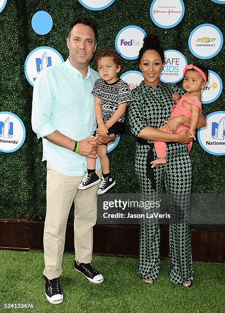 Adam Housley, Aden John Tanner Housley, Tamera Mowry and Ariah Talea Housley attend Safe Kids Day at Smashbox Studios on April 24, 2016 in Culver...