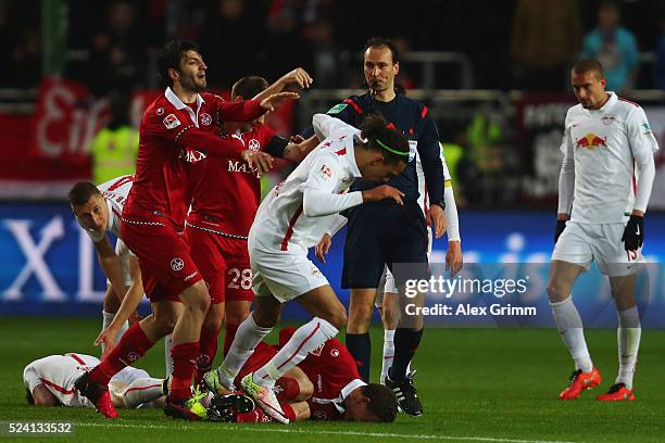 Markus Karl of Kaiserslautern pushes Yussuf Poulsen of Leipzig during the Second Bundesliga match between 1. FC Kaiserslautern and RB Leipzig at...