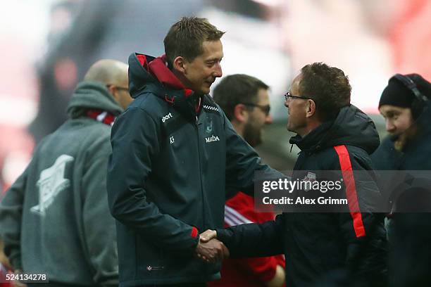 Head coaches Konrad Fuenfstueck of Kaiserslautern and Ralf Rangnick of Leipzig shake hands prior to the Second Bundesliga match between 1. FC...