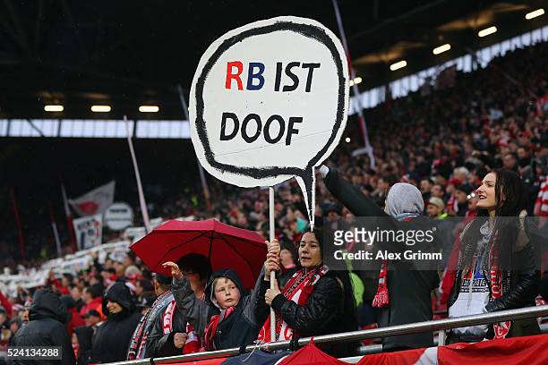 Fans of Kaiserslautern hold up banners to protest against Leipzig during the Second Bundesliga match between 1. FC Kaiserslautern and RB Leipzig at...