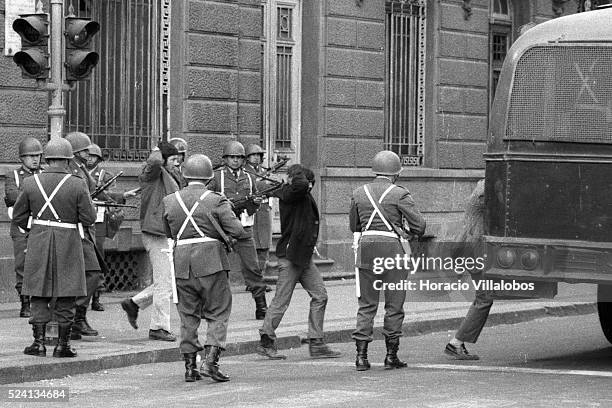 Group of Allendes bodyguards are held prisoners by Carabineros, across the street from La Moneda. All of them were killed later. Photographed during...