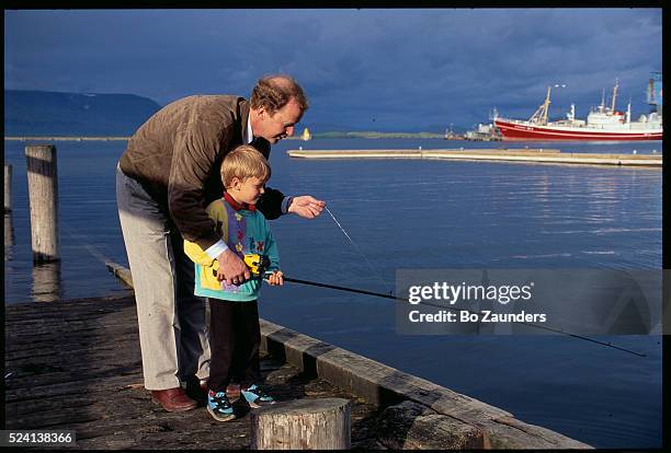 Father Showing Son How to Fish