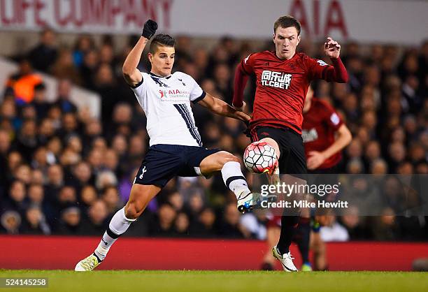 Erik Lamela of Tottenham Hotspur and Craig Gardner of West Bromwich Albion battle for the ball during the Barclays Premier League match between...