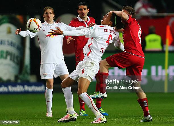 Yussuf Poulsen of Leipzig is challenged by Alexander Ring of Kaiserslautern during the Second Bundesliga match between 1. FC Kaiserslautern and RB...