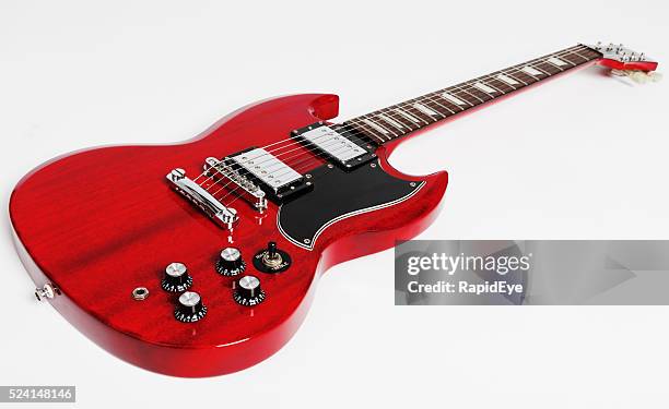 epiphone sg electric guitar angled on white background - gibson les paul guitar stock pictures, royalty-free photos & images