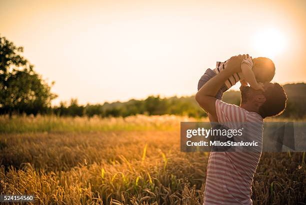 fatherhood - father sun stock pictures, royalty-free photos & images