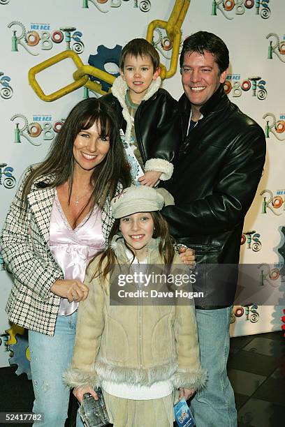 Model Linda Lusardi and her husband, actor Samuel Kane and their family arrive at the UK premiere of the animated film "Robots" at Vue Leicester...