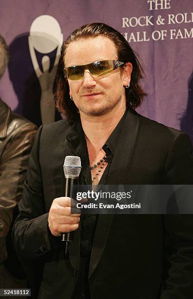 Inductee Bono of the rock group U2 poses backstage at the 20th Annual Rock And Roll Hall Of Fame Induction Ceremony at the Waldorf Astoria Hotel on...